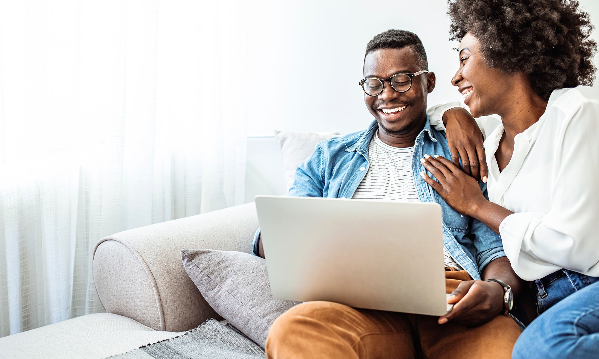 African american couple on laptop