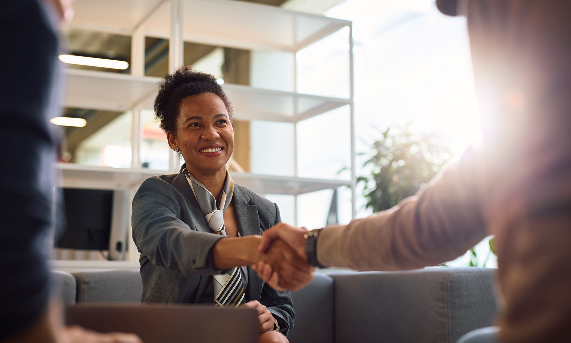 loan officer shaking hands with customer